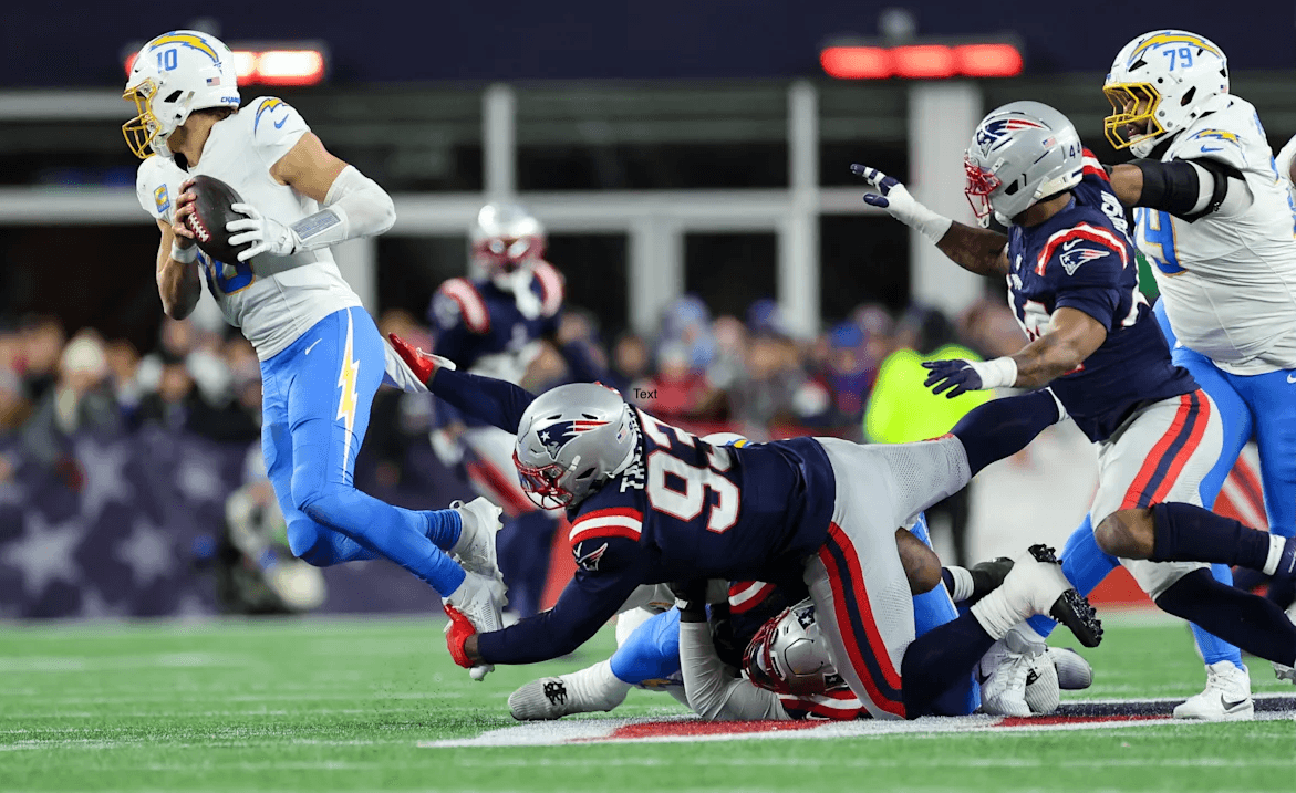 Justin Herbert gets sacked by the Patriots