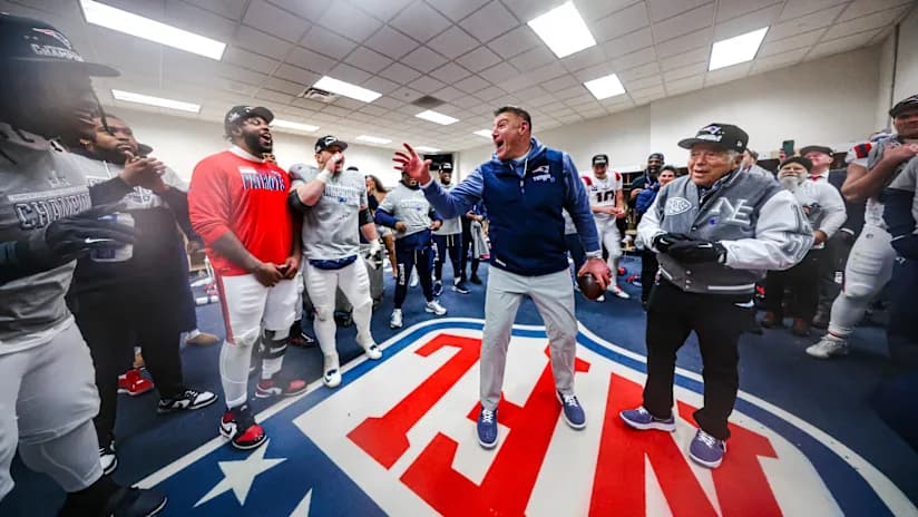 Patriots celebrate in the locker room after winning the conference championship in Denver